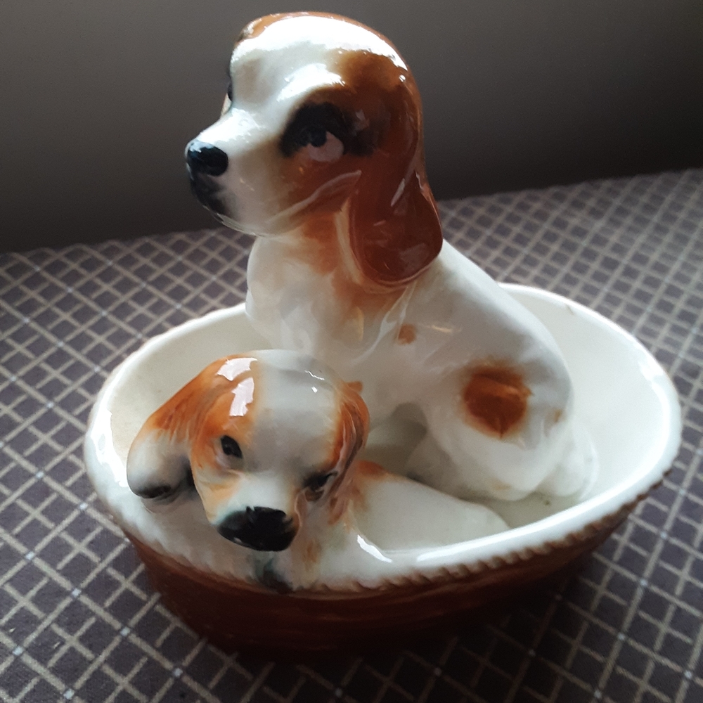 King Charles spaniels porcelain figurine, dogs in a basket.